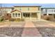 Backyard with covered patio and stone pathway at 9609 Rolling Thunder Ave, Las Vegas, NV 89148