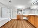 Main bathroom with wood cabinets, a shower, and bathtub at 9609 Rolling Thunder Ave, Las Vegas, NV 89148