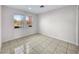 Bright and airy living room with tile floors at 9609 Rolling Thunder Ave, Las Vegas, NV 89148