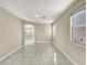 Bright and airy living room features tile flooring at 9609 Rolling Thunder Ave, Las Vegas, NV 89148