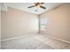 Well-lit bedroom with ceiling fan and neutral carpeting at 10809 Garden Mist Dr # 2093, Las Vegas, NV 89135