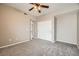 Bedroom with ceiling fan, carpet, and double door closet at 10809 Garden Mist Dr # 2093, Las Vegas, NV 89135