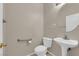 Clean powder room with pedestal sink and toilet at 1180 Swarthmore Ct, Las Vegas, NV 89110