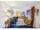 Bright and airy living room with a mix of modern and vintage furniture at 1655 E Hacienda Ave, Las Vegas, NV 89119