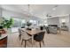 Bright dining area with wood table and access to backyard at 2183 Sawtooth Mountain Dr, Henderson, NV 89044