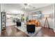 Living room with orange couch, wood floors, and a view of the kitchen at 220 Emerald Vista Way, Las Vegas, NV 89144