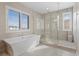 Spa-like bathroom with soaking tub, walk-in shower, and natural light at 267 Valleggia Dr, Las Vegas, NV 89138