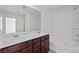 Bathroom with double vanity and a tub shower at 2932 Torreon Ln, Las Vegas, NV 89121