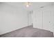 Bright bedroom with grey carpet, double door closet, and ceiling fan at 2932 Torreon Ln, Las Vegas, NV 89121