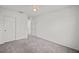 Well-lit bedroom featuring grey carpet and double door closet at 2932 Torreon Ln, Las Vegas, NV 89121