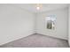 Well-lit bedroom with gray carpet and a window at 2932 Torreon Ln, Las Vegas, NV 89121