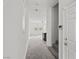 Bright entryway with stairs leading upstairs and view to living room at 2932 Torreon Ln, Las Vegas, NV 89121