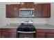 Modern kitchen with stainless steel appliances and granite countertops at 2932 Torreon Ln, Las Vegas, NV 89121