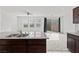 Kitchen with island, stainless steel appliances, and view to backyard at 2932 Torreon Ln, Las Vegas, NV 89121