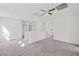 Bright and airy upper hallway with ceiling fan and access to bedrooms at 2932 Torreon Ln, Las Vegas, NV 89121
