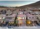 An aerial view of a residential area with well-maintained homes and mountain backdrop at 3213 Molinos Dr, Las Vegas, NV 89141