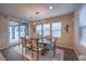 Elegant dining room featuring stylish light fixture and sliding door access to backyard at 3213 Molinos Dr, Las Vegas, NV 89141