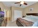 Well-lit bedroom featuring a spacious closet and a ceiling fan, complete with a cozy bed at 3740 Corte Bella Hills Ave, North Las Vegas, NV 89081