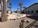 A community pool surrounded by palm trees at 3740 Corte Bella Hills Ave, North Las Vegas, NV 89081