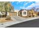 Attractive single-Gathering home featuring a well-kept yard and a convenient two-car garage at 3740 Corte Bella Hills Ave, North Las Vegas, NV 89081