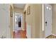 Inviting hallway featuring hardwood floors and neutral walls leads to a bright and airy living space at 3740 Corte Bella Hills Ave, North Las Vegas, NV 89081