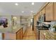 Spacious kitchen with granite counters, stainless steel appliances, and wood floors at 3740 Corte Bella Hills Ave, North Las Vegas, NV 89081