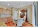 Bright kitchen nook with hardwood floors and a charming china cabinet at 3740 Corte Bella Hills Ave, North Las Vegas, NV 89081
