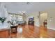 Bright and airy living room with large windows, hardwood floors, and comfortable seating at 3740 Corte Bella Hills Ave, North Las Vegas, NV 89081