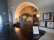 View of the stylish lobby with decorative arches and furniture at 3740 Corte Bella Hills Ave, North Las Vegas, NV 89081