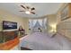 Main bedroom features a bay window, ceiling fan, and hardwood floors at 3740 Corte Bella Hills Ave, North Las Vegas, NV 89081