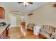 Home office with wood floors, built-in desk, and two armchairs at 3740 Corte Bella Hills Ave, North Las Vegas, NV 89081