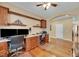 Home office includes built in desk, hardwood floors, and comfortable office chairs and decor at 3740 Corte Bella Hills Ave, North Las Vegas, NV 89081