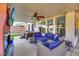 Outdoor patio featuring a hot tub, ceiling fan, comfortable seating and an outdoor television at 3740 Corte Bella Hills Ave, North Las Vegas, NV 89081