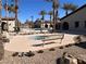 Relaxing community pool area with hot tub, benches and desert landscaping under a clear blue sky at 3740 Corte Bella Hills Ave, North Las Vegas, NV 89081