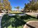 Sand traps add challenge and interest to the putting green and desert landscaping at 3740 Corte Bella Hills Ave, North Las Vegas, NV 89081