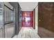 Stylish entryway with a red accent wall and marble flooring at 4381 W Flamingo Rd # 3710, Las Vegas, NV 89103