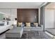 Open-concept living space featuring a sectional sofa and glass coffee table at 4381 W Flamingo Rd # 3710, Las Vegas, NV 89103