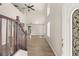 Bright and spacious entryway with wooden staircase and hardwood floors at 4712 Stable Way, North Las Vegas, NV 89032