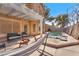 Inviting backyard with pergola, fire pit, and a hammock overlooking a refreshing pool at 5037 Monte Del Sol Ln, North Las Vegas, NV 89031