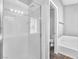 Bright bathroom featuring tiled shower with glass door and built-in tub at 5037 Monte Del Sol Ln, North Las Vegas, NV 89031