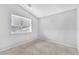Minimalist bedroom with neutral walls, carpet, and window with blinds at 5037 Monte Del Sol Ln, North Las Vegas, NV 89031
