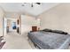 Spacious primary bedroom leading to Primary bath and neutral colored walls at 5037 Monte Del Sol Ln, North Las Vegas, NV 89031