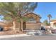 Charming two-story home with desert landscaping, a covered entry, and a two car garage at 5037 Monte Del Sol Ln, North Las Vegas, NV 89031