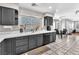 Well-lit kitchen featuring ample counter space, dark cabinetry, and stainless steel appliances at 5037 Monte Del Sol Ln, North Las Vegas, NV 89031