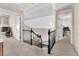 Carpeted stairway with wrought iron bannister and neutral walls at 5037 Monte Del Sol Ln, North Las Vegas, NV 89031