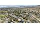 Expansive aerial view of a planned community with lush landscaping, golf course, and mountain views at 520 Summer Mesa Dr, Las Vegas, NV 89144