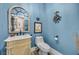 Charming powder room with unique vanity and blue walls at 520 Summer Mesa Dr, Las Vegas, NV 89144