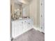 Elegant bathroom vanity with white cabinets and marble countertop at 520 Summer Mesa Dr, Las Vegas, NV 89144