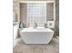 Modern bathroom with freestanding soaking tub and large window at 520 Summer Mesa Dr, Las Vegas, NV 89144