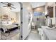 Charming bedroom with adjacent bathroom and wood-look floors at 520 Summer Mesa Dr, Las Vegas, NV 89144